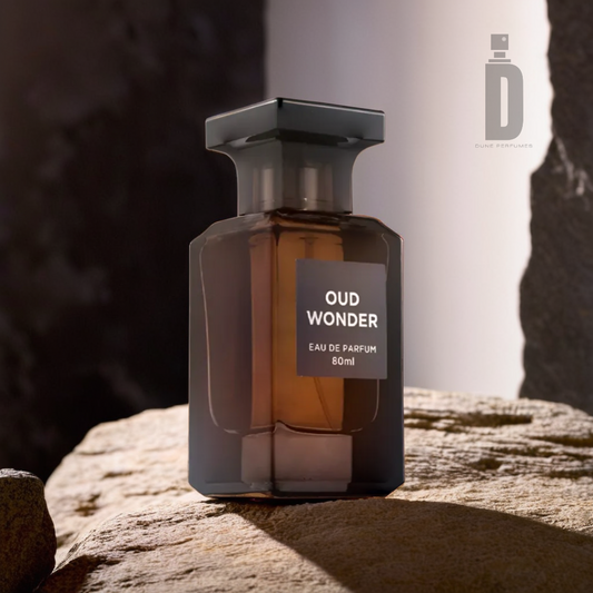 A dark, elegant perfume bottle labeled "Oud Wonder 80ml EDP - Fragrance World" rests on a textured rock surface, exuding a sense of mystery with its Oud fragrance. In the top right corner, the logo "Fragrance World" accompanies a stylized 'F', set against a blurred, earthy background.