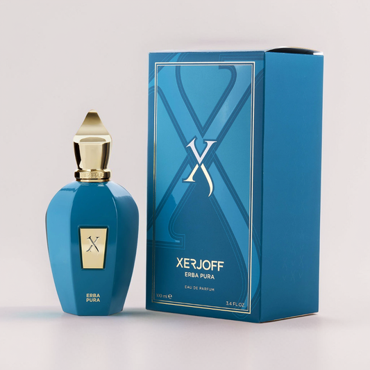 The Erba Pura 100ml EDP by Xerjoff features a blue bottle with a gold cap and label, offering a Mediterranean fragrance rich in citrus freshness. Its packaging highlights a prominent "X" design on the box.