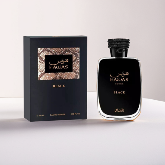 The Hawas Black 100ml EDP by Rasasi comes in a sleek, reflective bottle labeled "For Him," featuring elegant gold and white script on a dark background. The matching box has a textured pattern and woody notes enhance the allure of this distinguished fragrance.