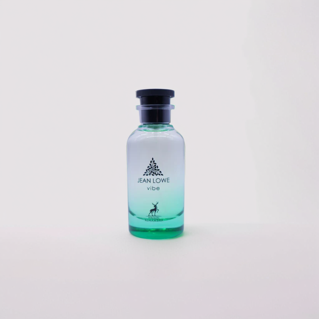 A Jean Lowe Vibe 100ml EDP by Maison Alhambra features a clear to green gradient bottle with a tree and deer logo, black cap, displayed on a white background.