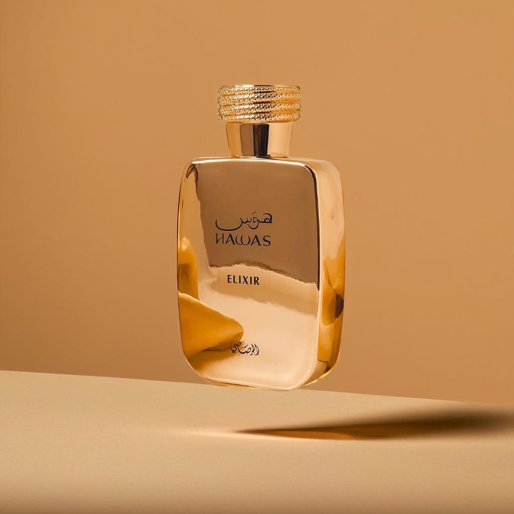 A shimmering gold Rasasi bottle labeled "Hawas Elixir 100ml EDP - Rasasi" floats elegantly against a light brown background, radiating luxury with its reflective surface.