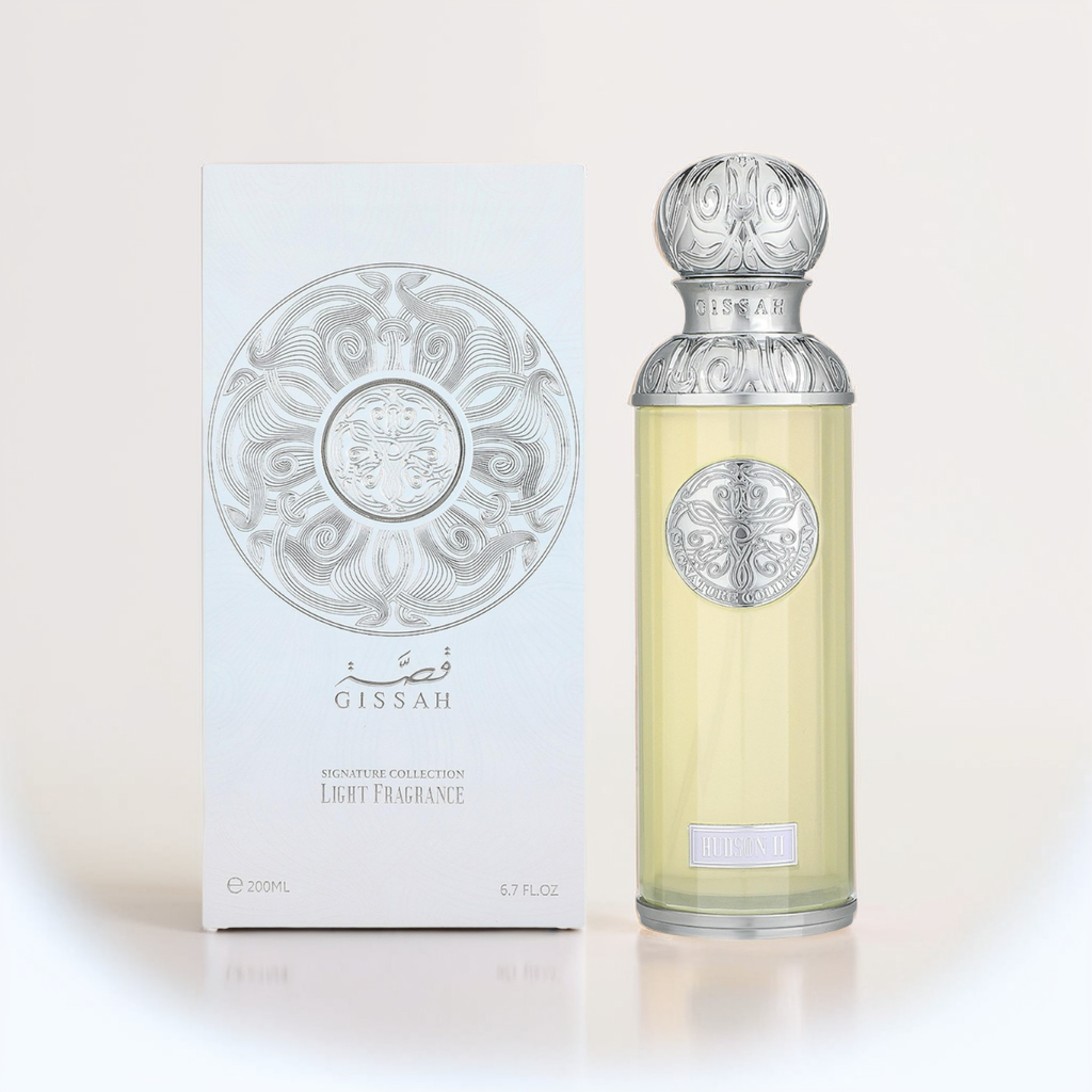 The Hudson II 200ml EDP by Gissah stands elegantly with its ornate silver-capped bottle and matching box, both adorned with intricate circular silver designs, subtly hinting at the fragrance's white rose notes in the "Gissah Signature Collection Light Fragrance.