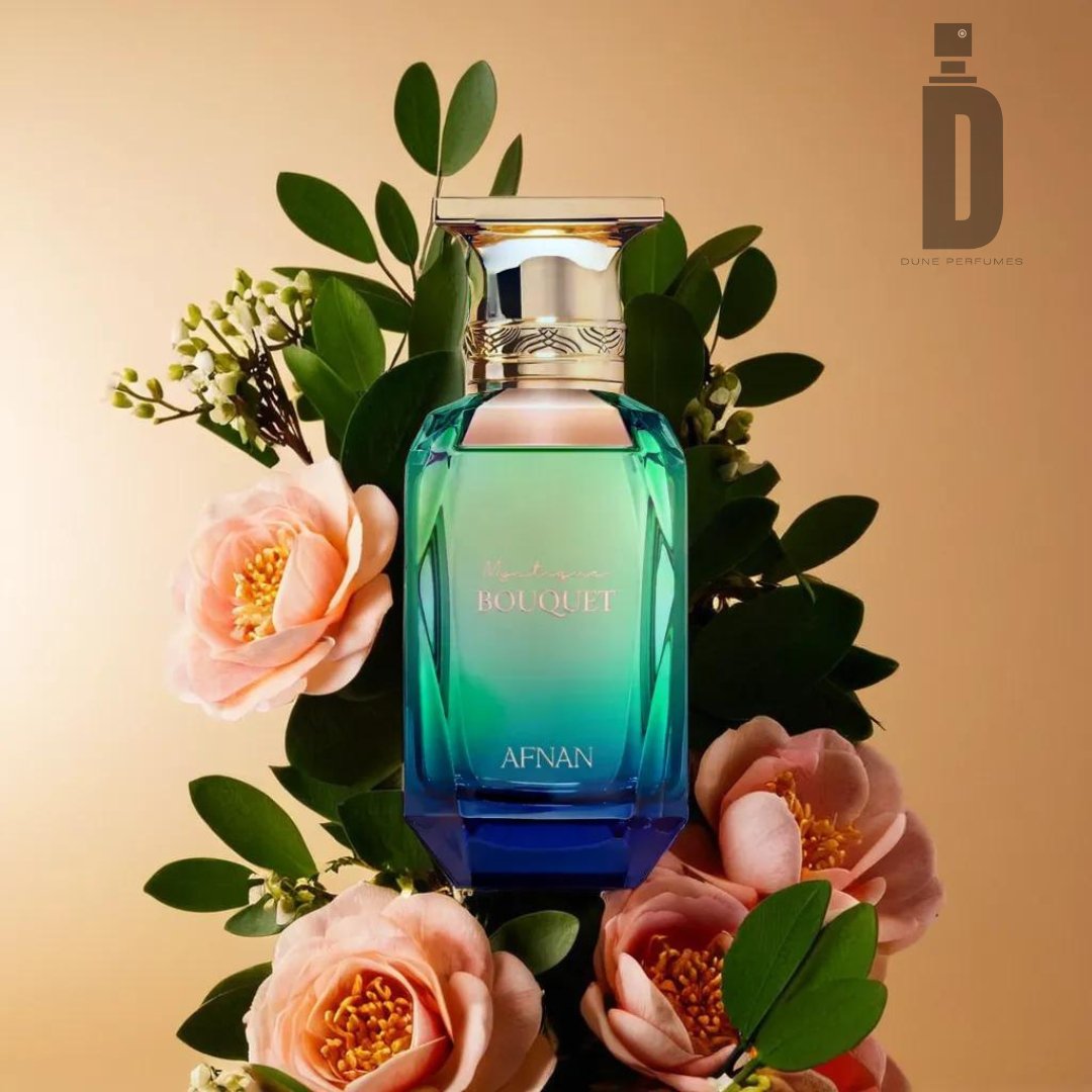 A perfume bottle labeled "Mystique Bouquet 80ml EDP - Afnan" stands out against a background adorned with pink flowers and green leaves, set against a warm beige gradient backdrop. The captivating fragrance of the Mystique Bouquet enhances the allure, while the "Dune Perfumes" logo is visible in the upper right corner.